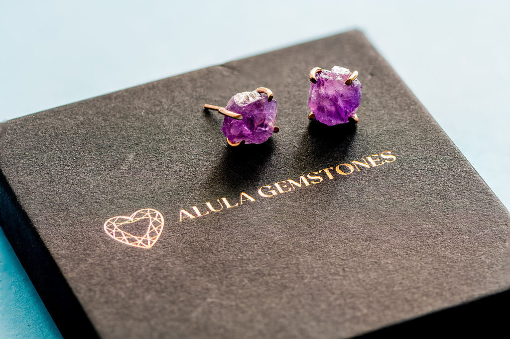 Amethyst Raw Gemstone Earrings in purple displayed on Alula Gemstones box
